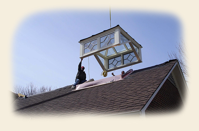 A Glass Roof Cupola Being Crane Hoist Installed by Renaissance Conservatories